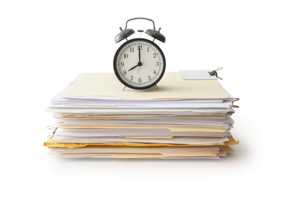 Clock on Stack of Papers